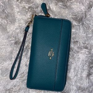 Emerald green Coach wallet. Received as a gift, never used. Mint condition!
